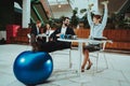 Woman and Man doing Fitness Exercises in Office Royalty Free Stock Photo