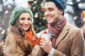 Woman and man drinking mulled wine on Christmas Market Royalty Free Stock Photo