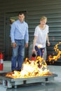 woman and man on firefighting drill