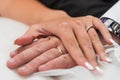 Woman and man getting married with finger rings