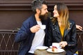 Woman and man with happy faces have date at cafe. Royalty Free Stock Photo