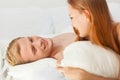 Woman and man having conversation in bed Royalty Free Stock Photo