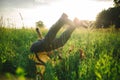 Woman and man having fun outdoors. Loving hipster couple walking in the field, kissing and holding hands, hugging, lying in the Royalty Free Stock Photo