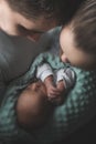 Woman and man holding on hands a newborn. Mom, dad and baby. Portrait of young family. Happy family life. Man was born Royalty Free Stock Photo