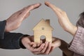 Woman and man holding house model Royalty Free Stock Photo