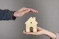 Woman and man holding house model Royalty Free Stock Photo