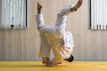 Woman and man judo fighters in sport hall Royalty Free Stock Photo