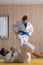 Woman and man judo fighters in sport hall Royalty Free Stock Photo