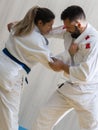 Woman and man judo fighters in sport hall Royalty Free Stock Photo