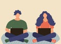 Woman and man with a laptop sit on the carpet and work. Freelancers or students. Home office concept. Royalty Free Stock Photo