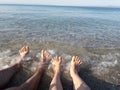 Woman and man legs in the sea Royalty Free Stock Photo