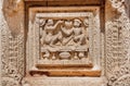 Woman and man in old house - Indian wood carvings on door of the Palace of Mysore, built in 1912 in India