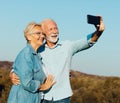 woman man outdoor senior couple happy lifestyle retirement together smiling love selfie camera mature Royalty Free Stock Photo