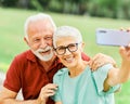 woman man outdoor senior couple happy lifestyle retirement together smiling love selfie camera mature Royalty Free Stock Photo