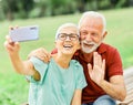 woman man outdoor senior couple happy lifestyle retirement together smiling love selfie camera mature Royalty Free Stock Photo