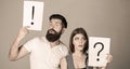 Woman and a man a question, exclamation point. Couple in quarrel. Question mark. Quarrel between two people. Pensive man Royalty Free Stock Photo