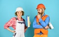 Woman and man safety hard hat. Discussing renovation with contractor. Sign contract with workers. Price list. Couple Royalty Free Stock Photo