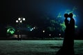 Woman and man silhouettes in the evening park Royalty Free Stock Photo