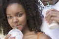 Woman With Man Sipping Milkshake