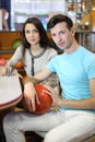 Woman and man sit at table in bowling