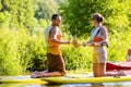 Woman and man with stand up paddle board sup on river Royalty Free Stock Photo