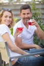 woman and man in vineyard drinking wine Royalty Free Stock Photo