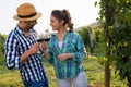 Woman and man in vineyard drinking wine Royalty Free Stock Photo