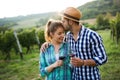 Woman and man in vineyard drinking wine Royalty Free Stock Photo