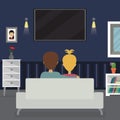 Woman and man watching television show at home