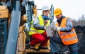 Woman and man worker in quarry on excavation machine Royalty Free Stock Photo