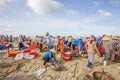 Woman and man working on the beach near Long Hai fish market Royalty Free Stock Photo