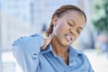 Woman manager with stress and pain in her neck while standing outside the office building. Female business leader at Royalty Free Stock Photo