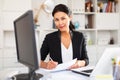 Woman manager working with laptop and documents in office