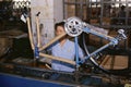 Woman on manufacturing assembly line