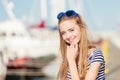 Woman in marina against yachts in port