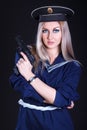 Woman in the marine uniform with a gun Royalty Free Stock Photo