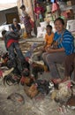 Woman at market with chickens
