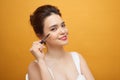 Woman mascara applying brush, female portrait makeup eyelashes