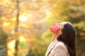 Woman with mask breathing fresh air in a forest in autumn Royalty Free Stock Photo