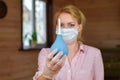 Woman in mask with enema. bowel lavage Royalty Free Stock Photo