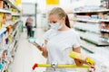 A woman i buys in a supermarket. Royalty Free Stock Photo