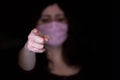 Woman in a mask points to you, protect yourself and others from infection. Covid 19, Coronavirus. Stay at home and do not go to