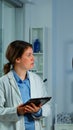 Woman with mask running on cross trainer testing heart rate