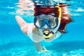 Woman with mask snorkeling