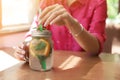 Woman with mason jar of tasty natural lemonade in cafe, closeup. Detox drink Royalty Free Stock Photo