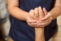 Woman in a massage room kneads a brush to patient