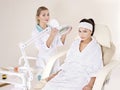 Woman on massage table in beauty spa.