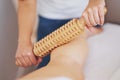 Woman at massage therapy with wooden tools