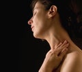 Woman massaging her neck