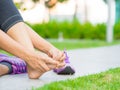 Woman massaging her painful foot. Royalty Free Stock Photo